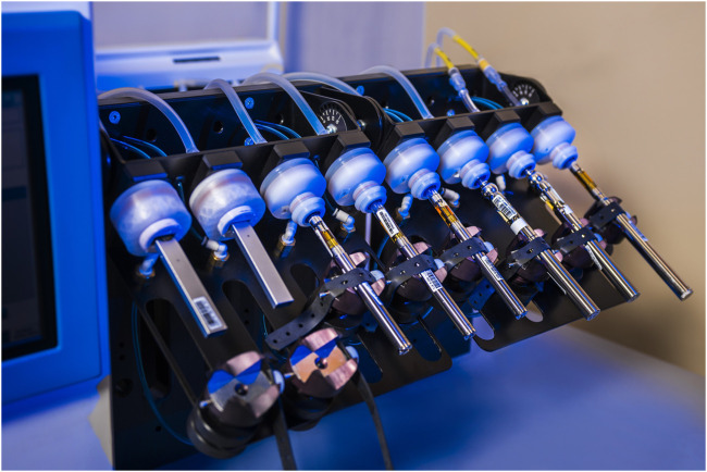 Experimental vaping setup of various EVPs analyzed. The two on the left demonstrate the custom-built holders and “lips” used for vaping products with mouthpieces of differing shape than those to the right which fit standard holders.