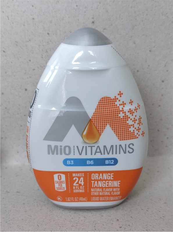 This image displays a front view of a bottle of MiO®, a popular beverage enhancer product that commonly includes food-grade ingredients such as vitamins, natural flavors, and/or caffeine. The image is provided to show the potential resemblance and similarities to the squeeze device