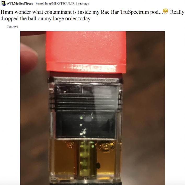 Unidentified black ball in the middle right side of a vape cartridge. This figure shows a close-up picture of a vaporizer cartridge that has a possible contaminant on the right side of the cartridge close to the center. The possible contaminant appears to be circular, black in color, and very close to the center tube or heating chamber in the cartridge. The company name across the center of the cartridge was blurred out using Photoshop. Adapted from FLMedicalTrees.