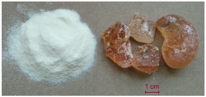 Gum arabic in the form of powder and crystals.
