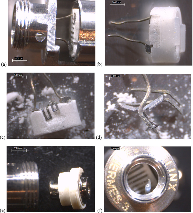 10-20x stereozoom microscope images of components from new Hermes THC cartridge.a) battery contact removed and metal end cap wall sawed off, showing filament embedded in ceramic, housed in a clear rubbery envelope inside a metal insert. b) heating element removed, showing rubbery envelope. c) ceramic chipped away to reveal square geometry of filament turns. d) filament removed from ceramic, showing brazed wire lead. e) battery contact with white, rubbery gasket. f) view towards heating element with battery contact removed, showing clear polymer sheath around one wire lead.