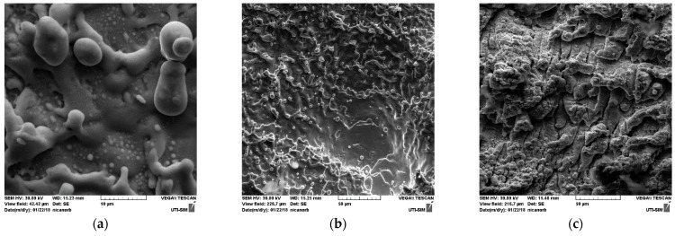 SEM images on ablated zone of the target with re-deposition structures: 5 kx magnitude (a); 1 kx magnitude (b,c).