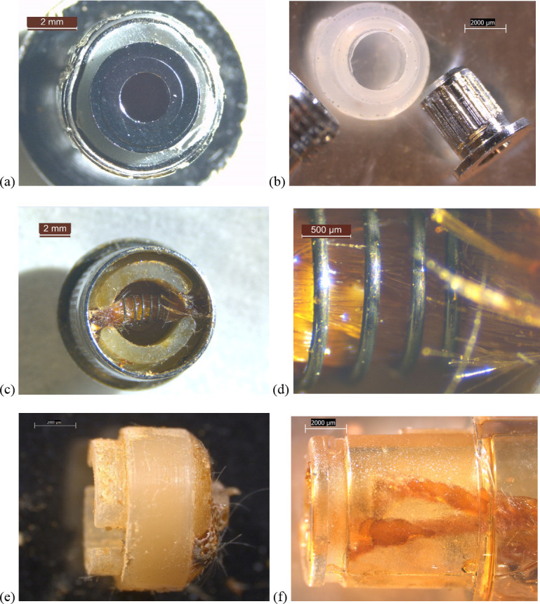 6.3-40x stereozoom microscope images of components from new THC cartridge “unknown #1”.a) upstream end of cartridge with battery contact b) battery contact and clear polymer gasket. c) downstream end of metal cartridge end cap showing fibrous wick inside filament, itself embedded in rubbery cap. d) same as (c) at higher magnification. e) side view of rubbery cap with brown substance and fibers where filament wire leads passed through. f) plastic tank walls and wick pieces.